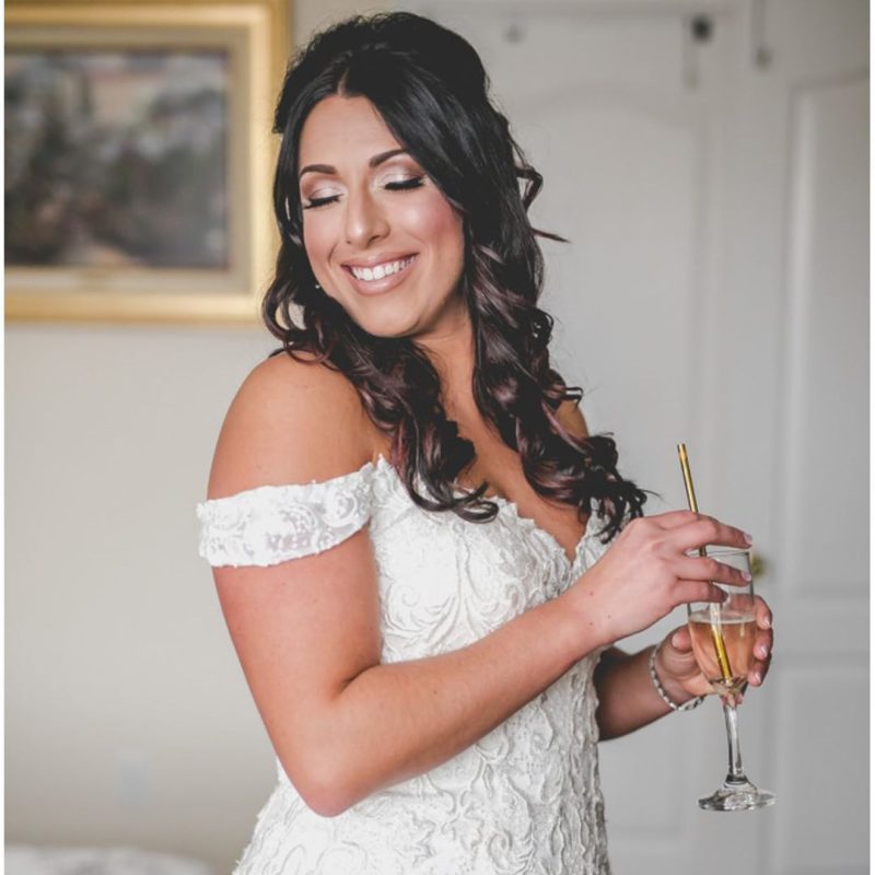 Clarks Landing Yacht Club Bride holding signature drink champagne